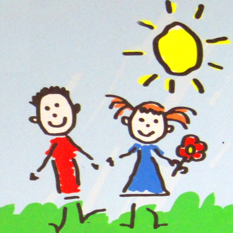 child's drawing of blue sky, yellow sun, boy in red, girl in blue holding red flower, green grass